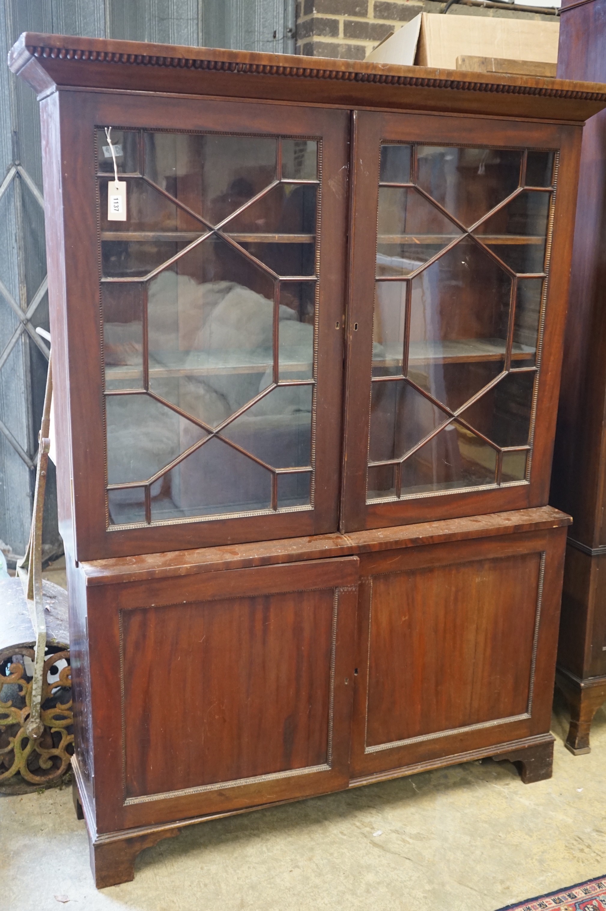 A Victorian mahogany glazed bookcase, width 126cm, depth 34cm, height 169cm